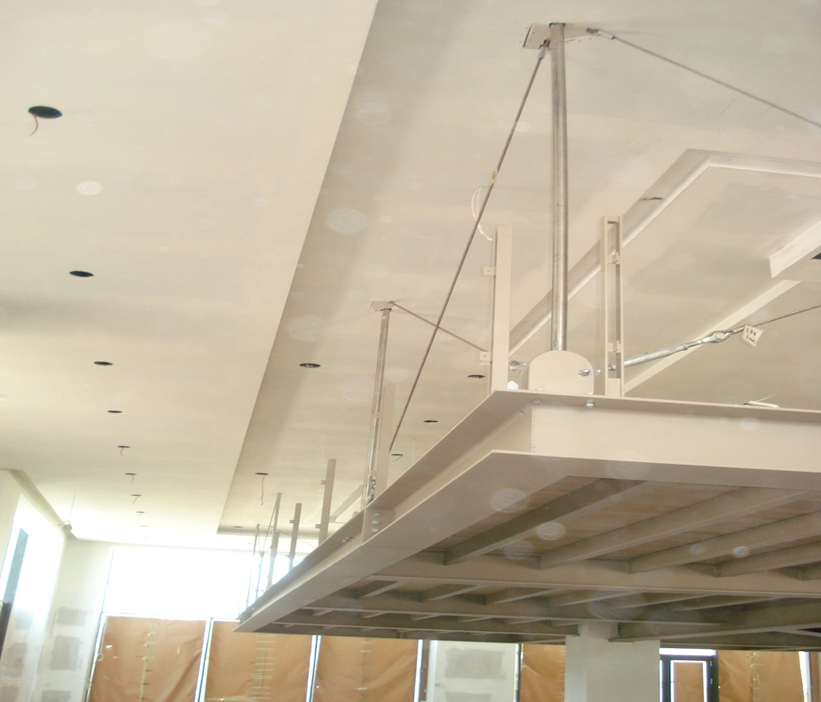 Suspended steel structure from the existing flat slab, Mexil A.E.